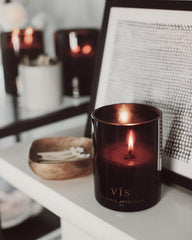Bedroom setup with Vis Discovery Candle for relaxing atmosphere