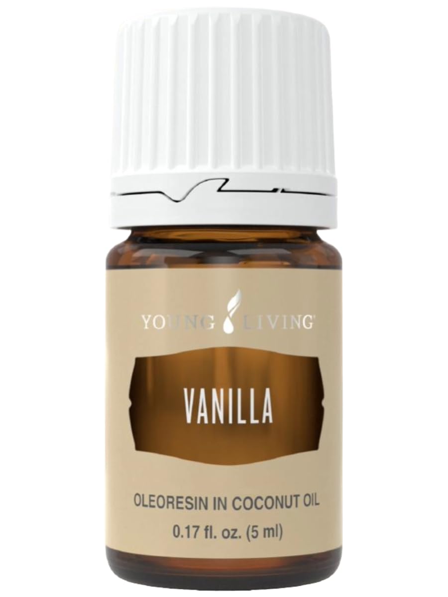 Vanilla essential oil diffusing in a diffuser creating warm ambiance.