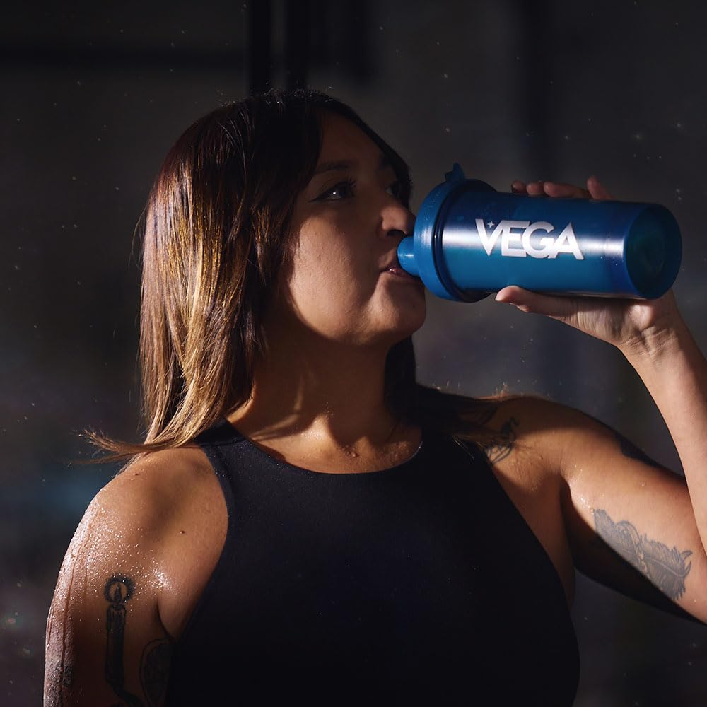 Vega Sport Peanut Butter flavor scoop and tub on kitchen counter