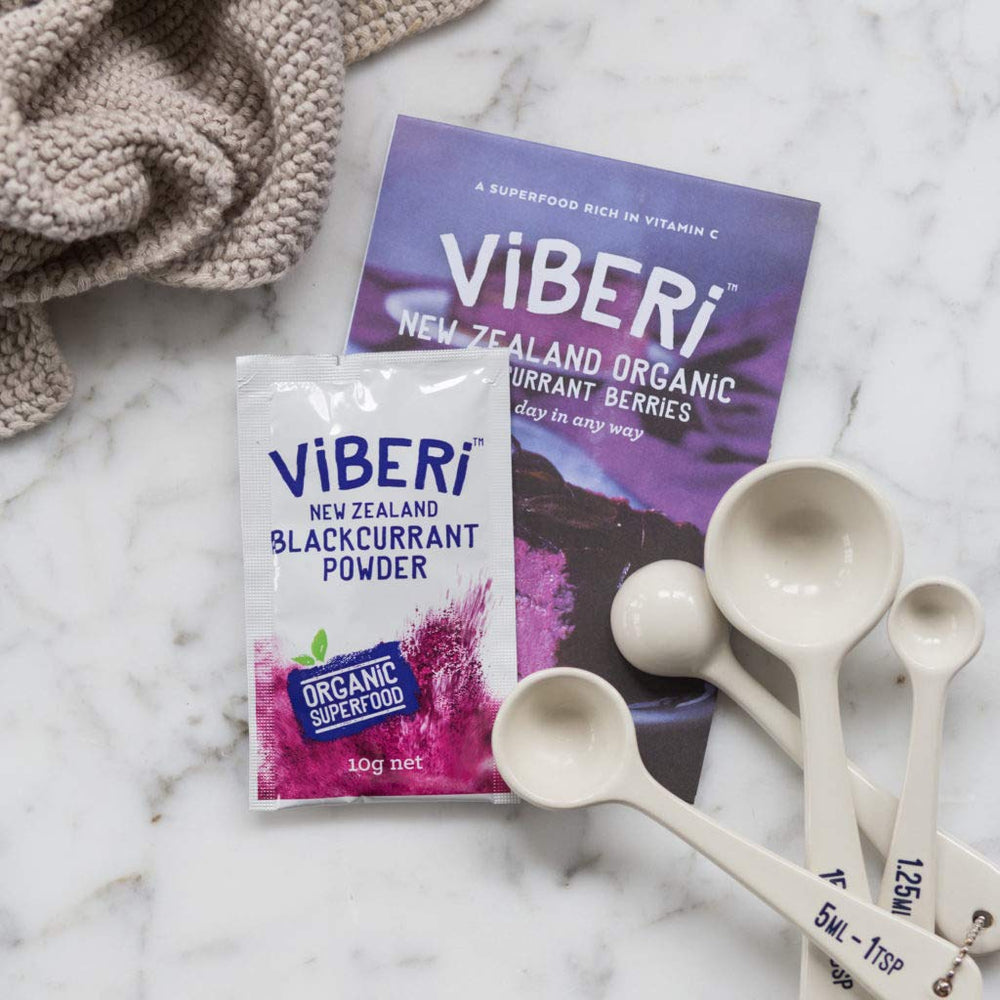 ViBERi Blackcurrant Powder Sachets Open for quick blends in smoothies.