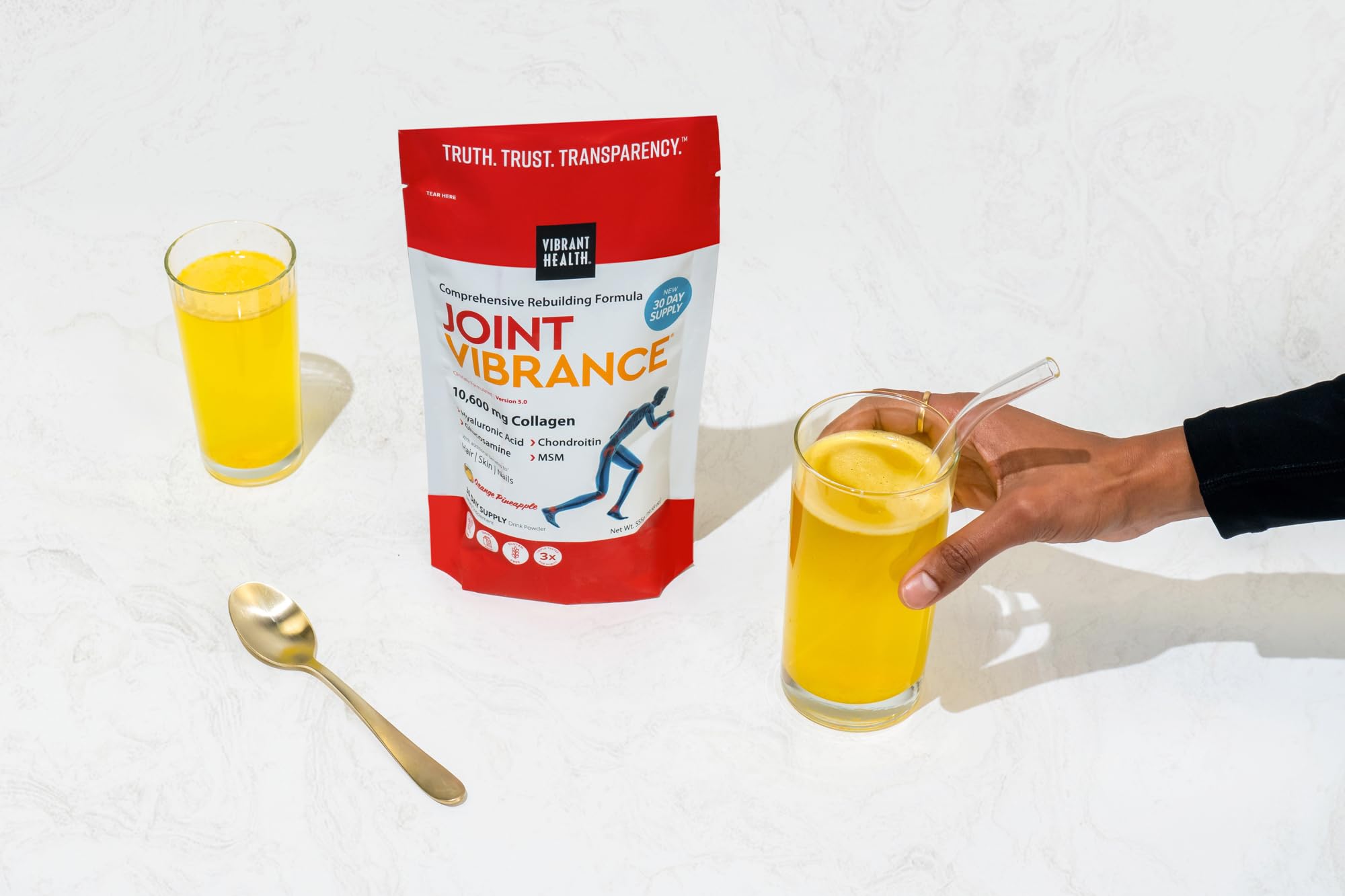 Vibrant Health Joint Vibrance glass with water demonstrates easy dilution into beverages