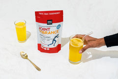Vibrant Health Joint Vibrance glass with water demonstrates easy dilution into beverages