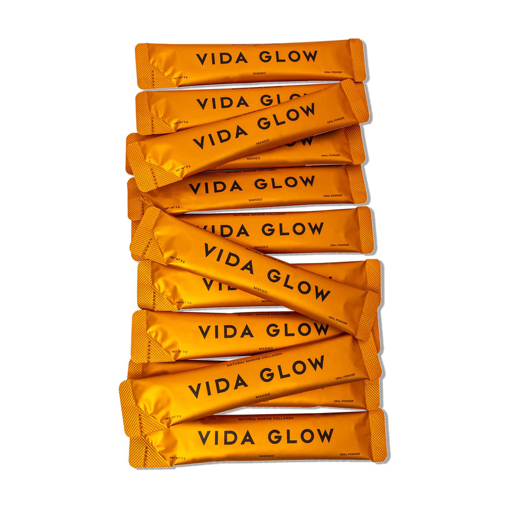 Vida Glow Marine Collagen Powder mango flavor in glass for a tasty mix