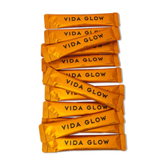 Vida Glow Marine Collagen Powder mango flavor in glass for a tasty mix