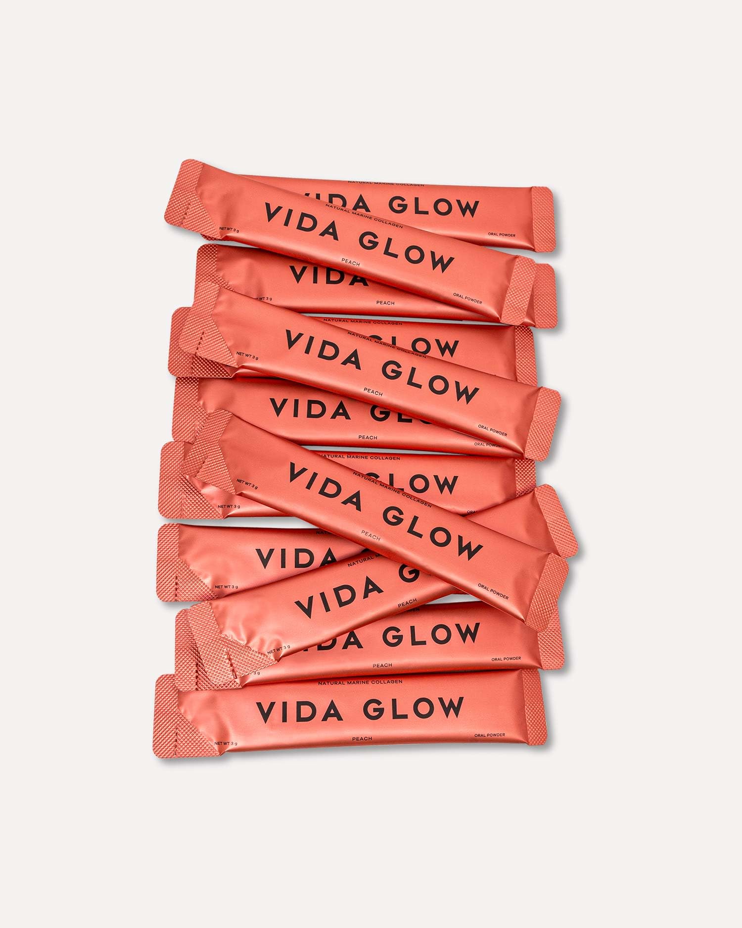 Vida Glow Marine Collagen Powder peach glass emphasizes flavorful, convenient drink boost.