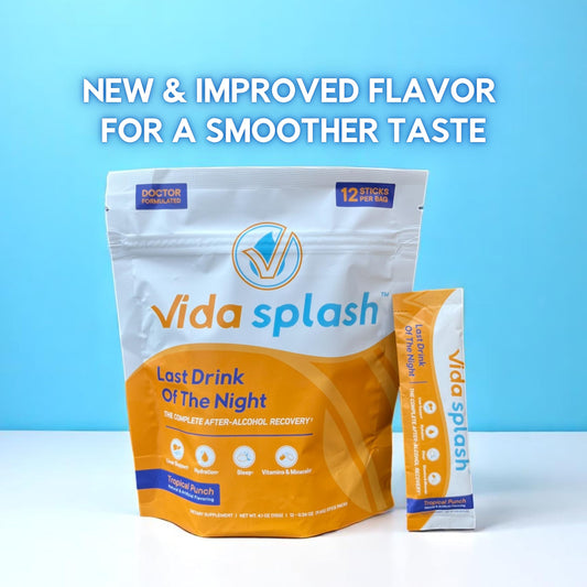 Vida Splash Tropical Punch stick dissolving in water for a refreshing recovery drink.