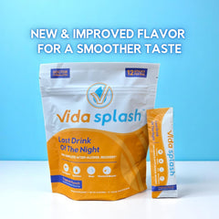 Vida Splash Tropical Punch stick dissolving in water for a refreshing recovery drink.