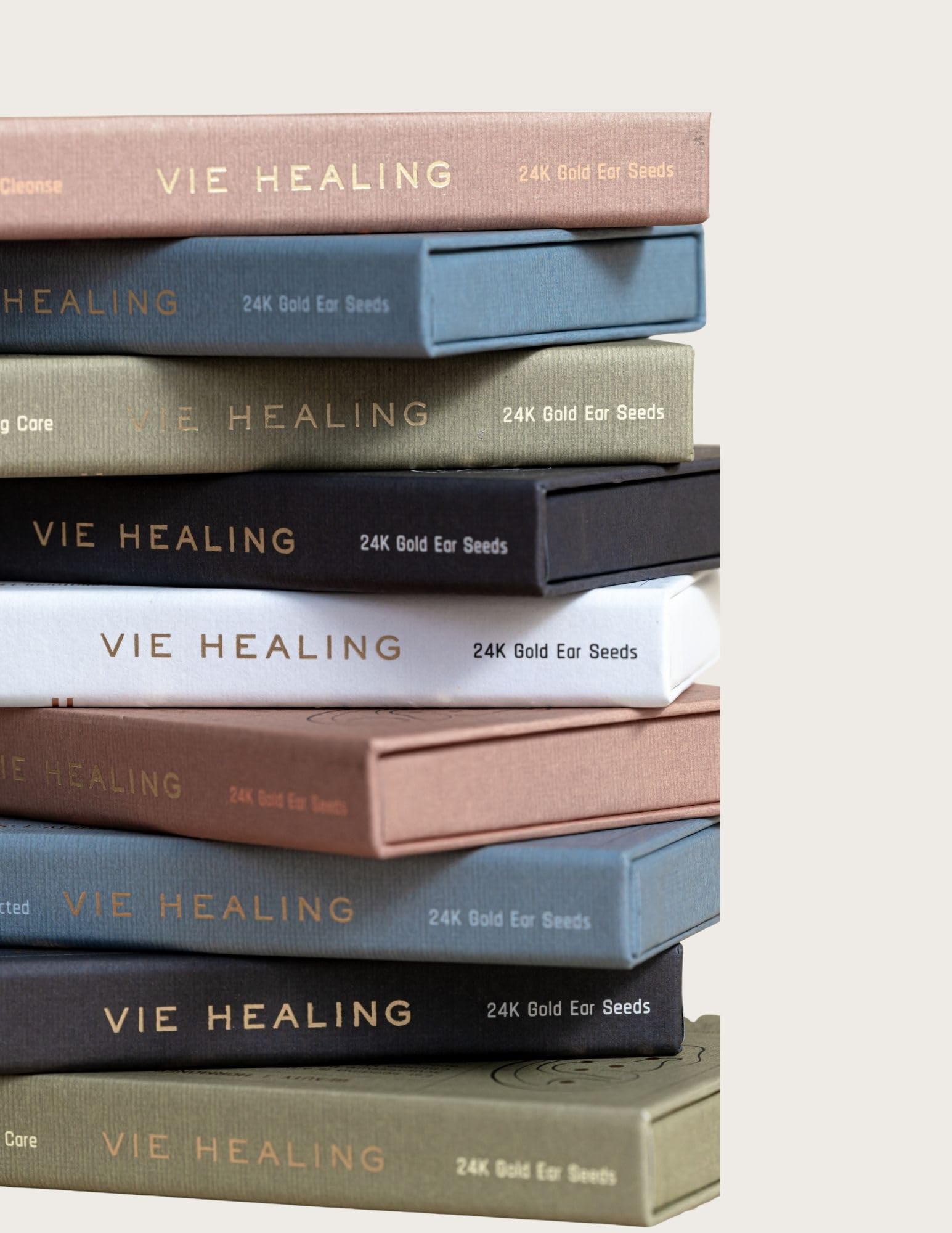 In-use illustration of applying Vie Healing ear seeds during routine.