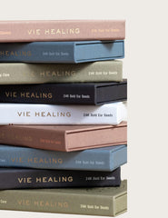 In-use illustration of applying Vie Healing ear seeds during routine.