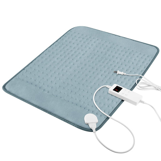 Vilicert heating pad on bed with gray cover for cramp relief and relaxation.