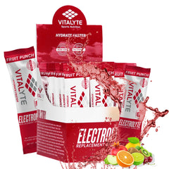 Vitalyte electrolyte packets in fruit punch packaging ready for travel hydration.