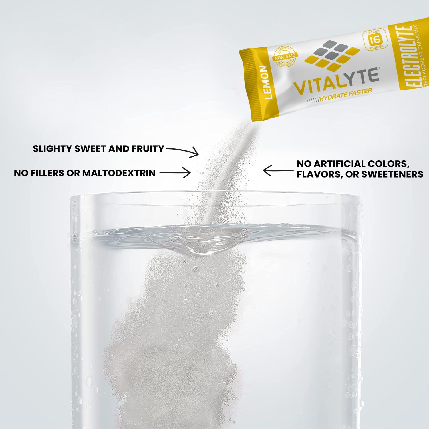 Vitalyte lemon powder being stirred in a glass for easy hydration.