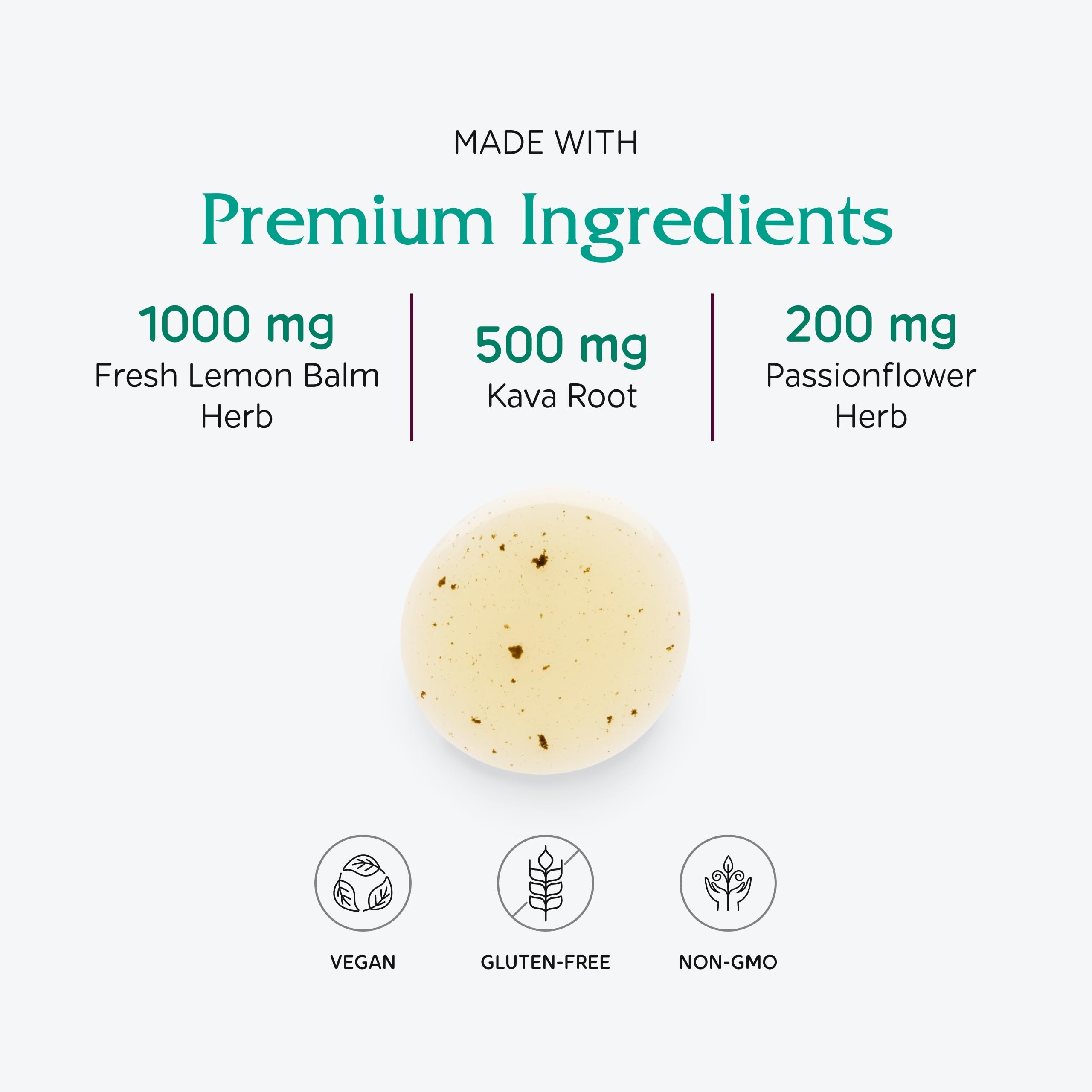 Lemon balm leaves beside Vitanica Daily Calm Tonic bottle highlighting natural ingredients.