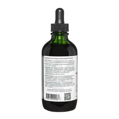 Liquid Sleep Tonic swirling in a glass with a soft amber color