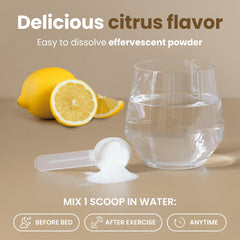 Glass with citrus-fizz from Vitasei Magnesium Total Care after mixing.