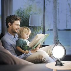 Voraiya lamp in use near laptop demonstrates memory and timer features.