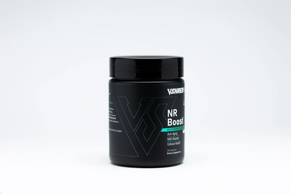 V Shred MD NR Boost capsules on a clean surface highlighting vitality.