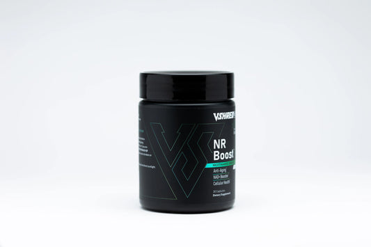 V Shred MD NR Boost capsules on a clean surface highlighting vitality.