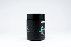 V Shred MD NR Boost capsules on a clean surface highlighting vitality.