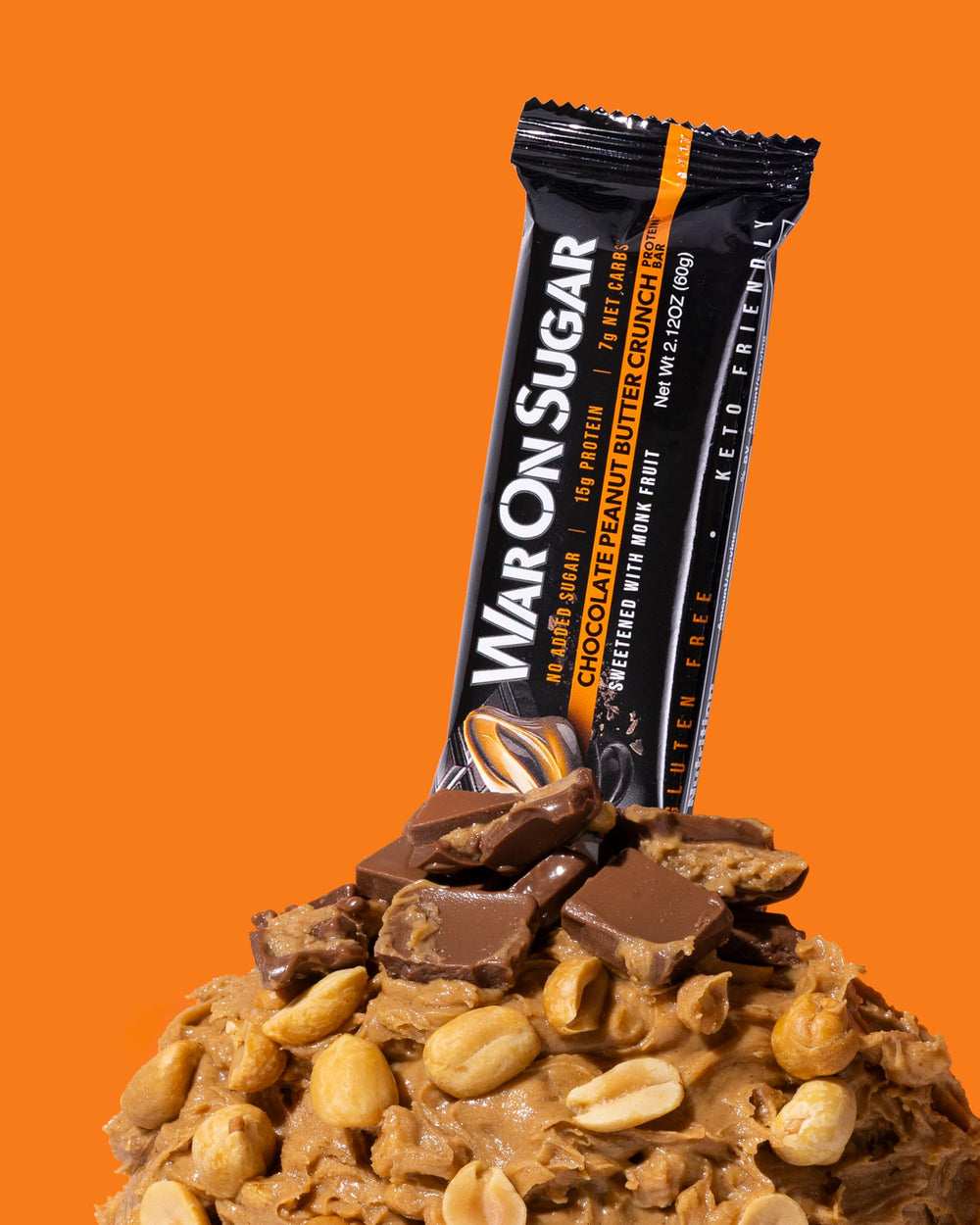 War on Sugar Chocolate Peanut Butter Crunch bar in hand demonstrates portable, protein-packed snack for workouts.