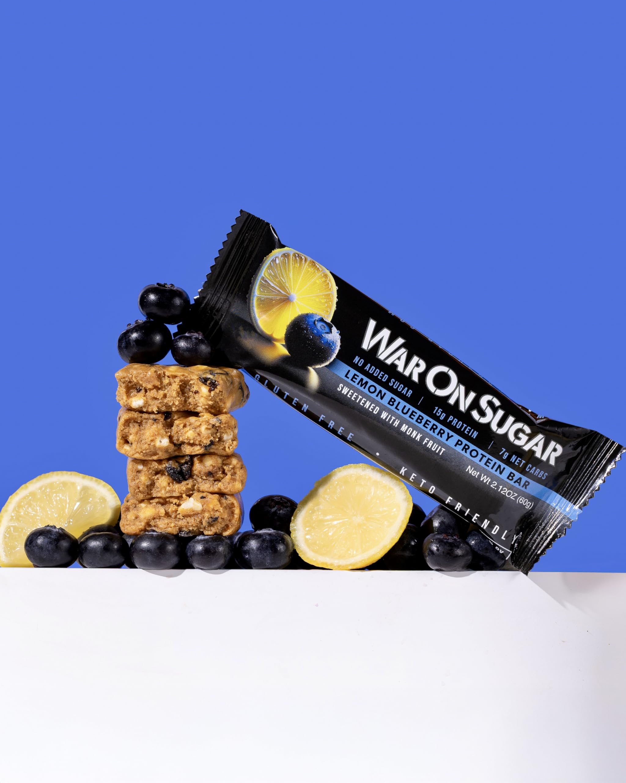 War on Sugar Lemon Blueberry bar on a desk, ready for post-workout snacking.