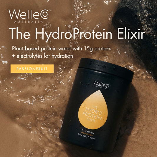 Scoop and powder of WelleCo HydroProtein Elixir for daily protein boost