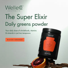 Pouring WelleCo The Super Elixir powder from a bottle into a glass for morning energy