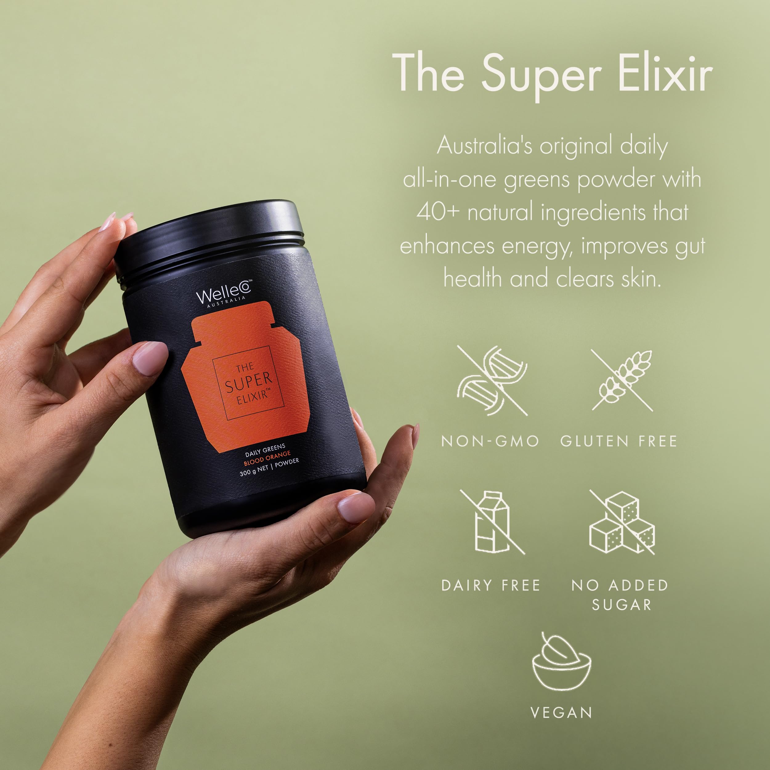 Glass with prepared WelleCo The Super Elixir drink showing a vibrant, inviting color