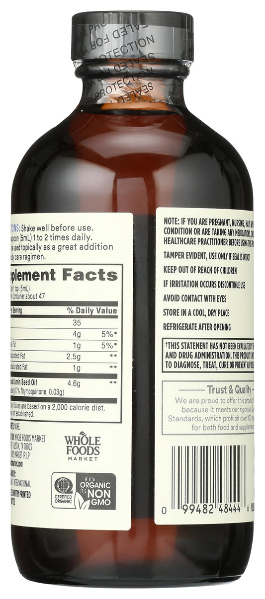 Whole Foods Market Organic Black Seed Oil bottle back explains ingredients and vegan, kosher status