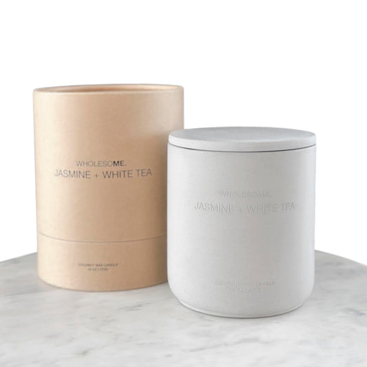 WHOLESOME Jasmine White Tea candle in a jar enhances delicate fragrance in your space.