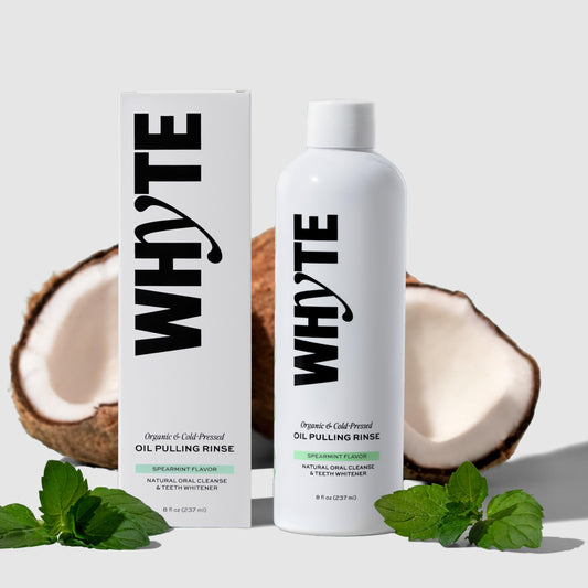 WHYTE coconut oil pulling mouthwash bottle pouring for lasting freshness