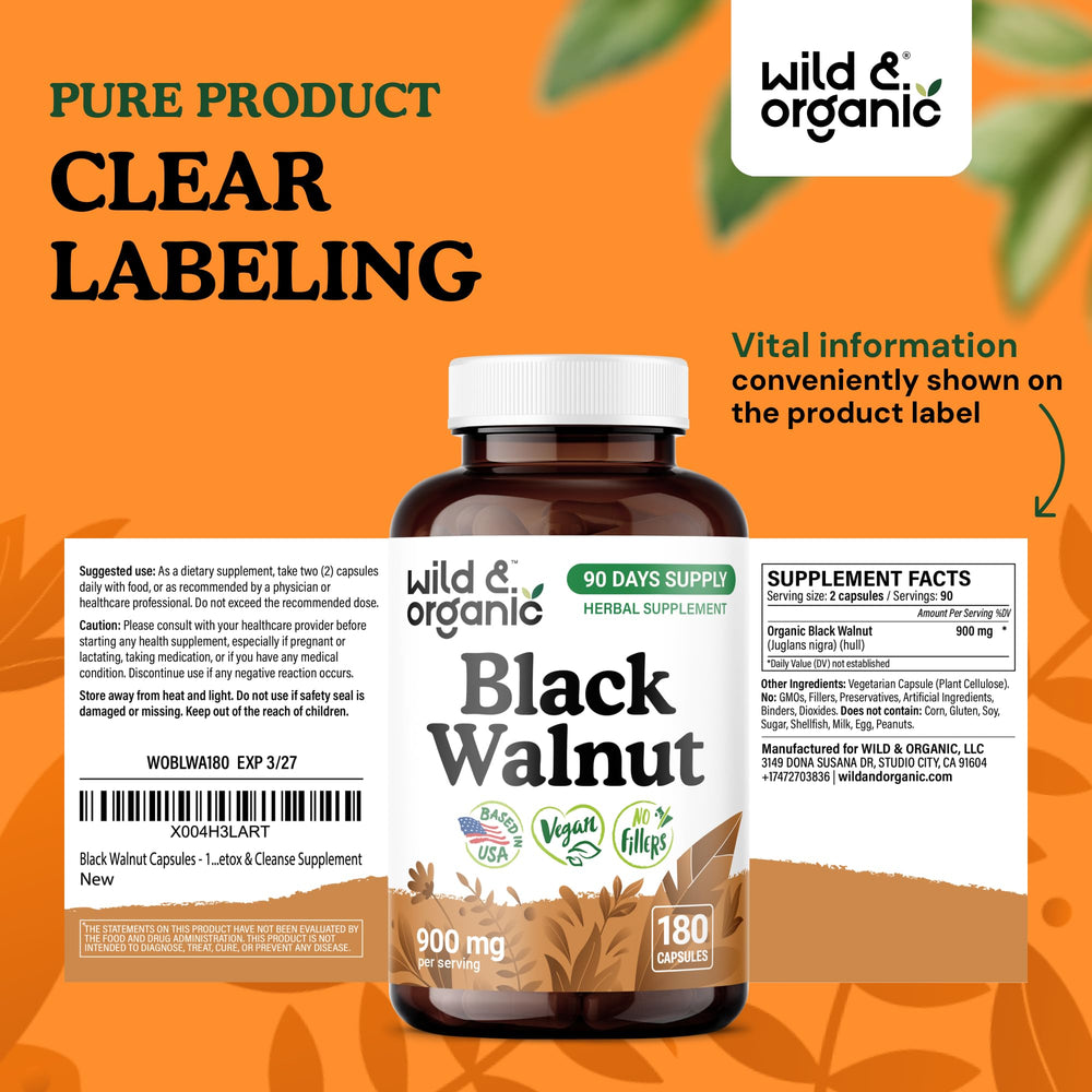 Wild & Organic black walnut hull capsules ready for daily use in hand.