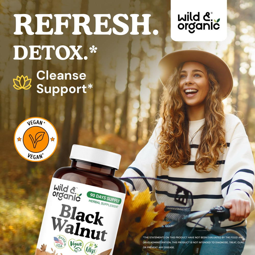 Wild & Organic black walnut hull capsules label shows vegan, non-GMO formula.