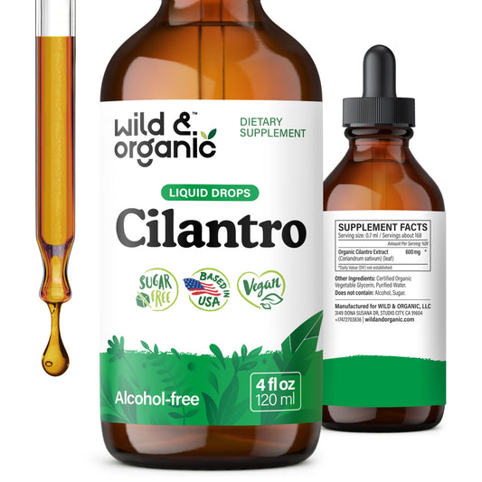 Wild and Organic cilantro tincture bottle on wood for detox support
