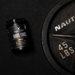 Wilderness Athlete Brute Force amino blend scoop highlights strength-focused benefits during training.