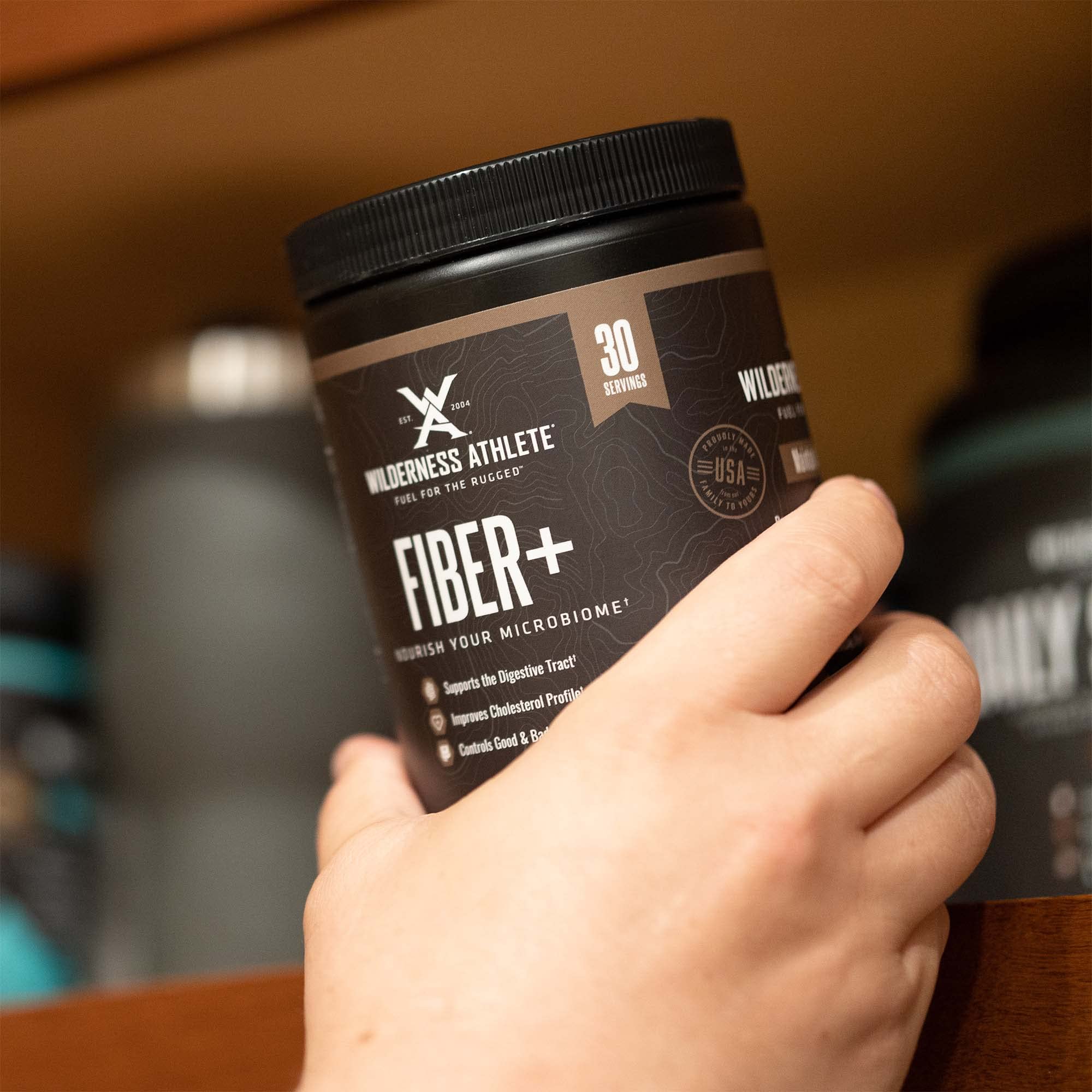 Wilderness Athlete Fiber+ unflavored powder stirred into smoothie for convenient daily use