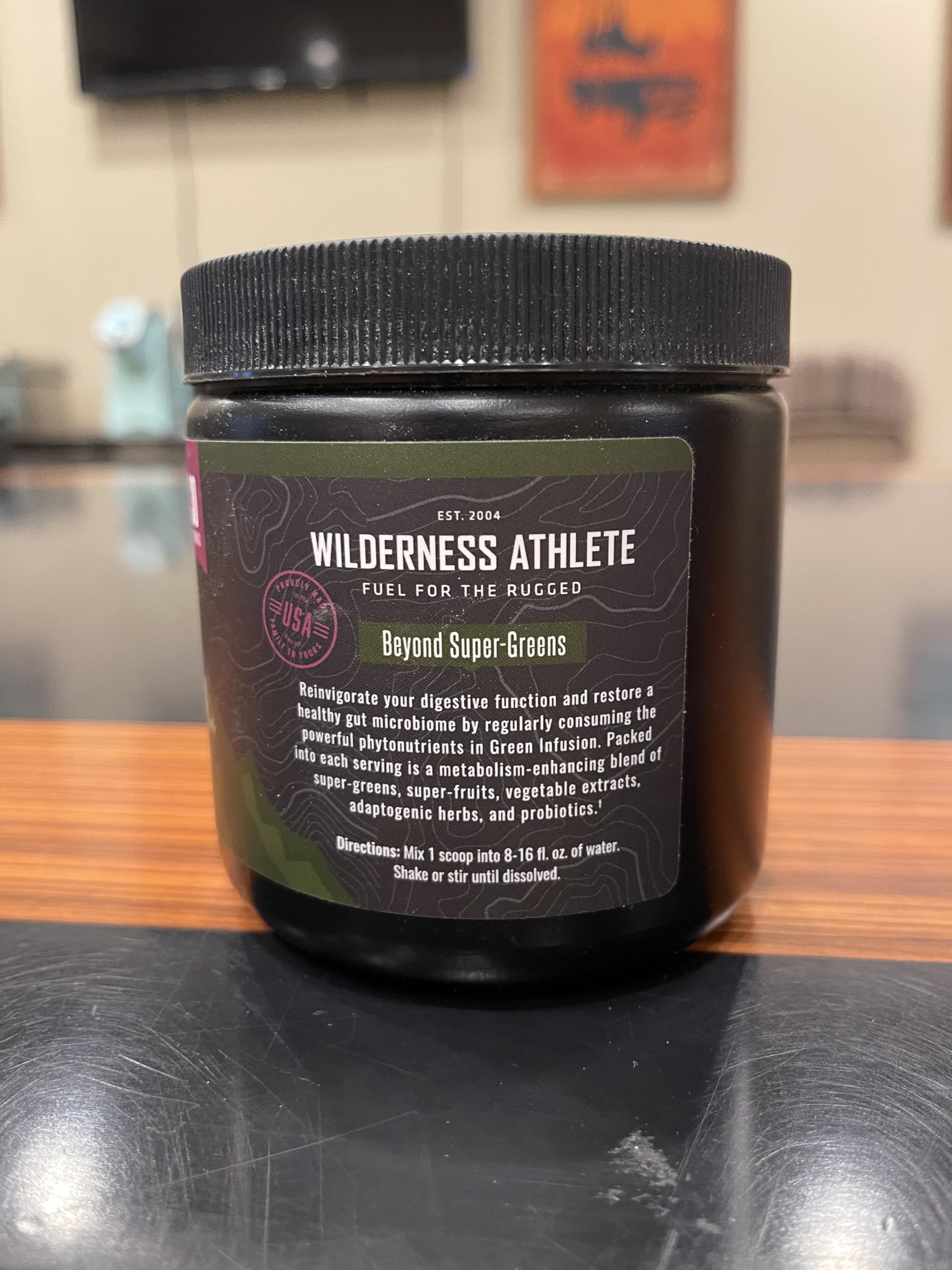 Wilderness Athlete Green Infusion powder-dispense close-up for quick smoothies and shakes.