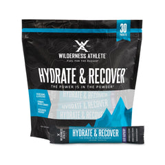 Wilderness Athlete Hydrate & Recover packets closeup, blue raspberry flavor, convenient daily hydration.