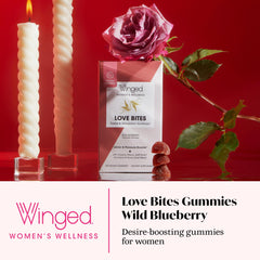 Winged Wellness Love Bites gummies close-up with blueberry flavor for daily vitality.