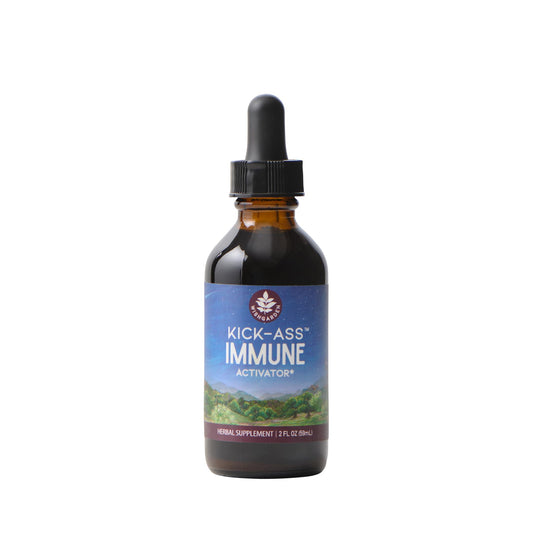 WishGarden Kick-Ass Immune Activator bottle pour shows a rich herbal tincture for immune support.