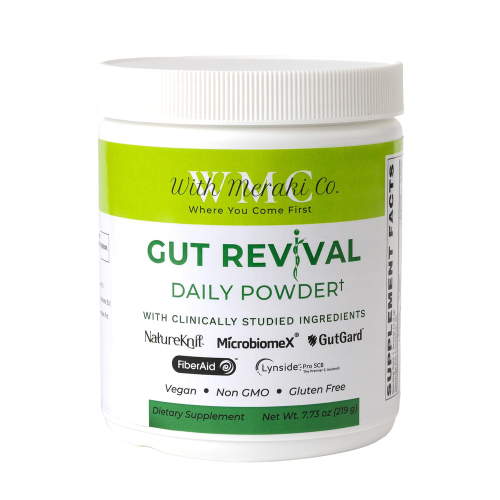 With Meraki Co. Gut Revival bottle closeup for supporting microbiome balance and digestive wellness.