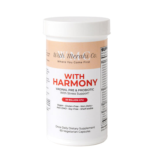 With Meraki Co Harmony probiotic bottle close-up highlighting vaginal and hormonal support.