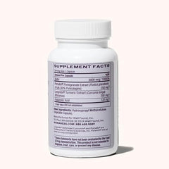 Womaness Active Glow capsules closeup featuring biotin and hyaluronic acid for hair and skin support