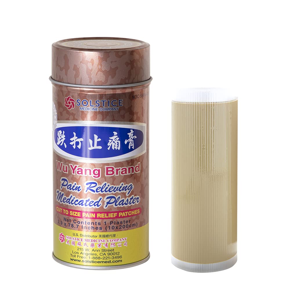 Wu Yang Brand Pain Relieving Medicated Plaster applied to back area for cooling soothing relief.