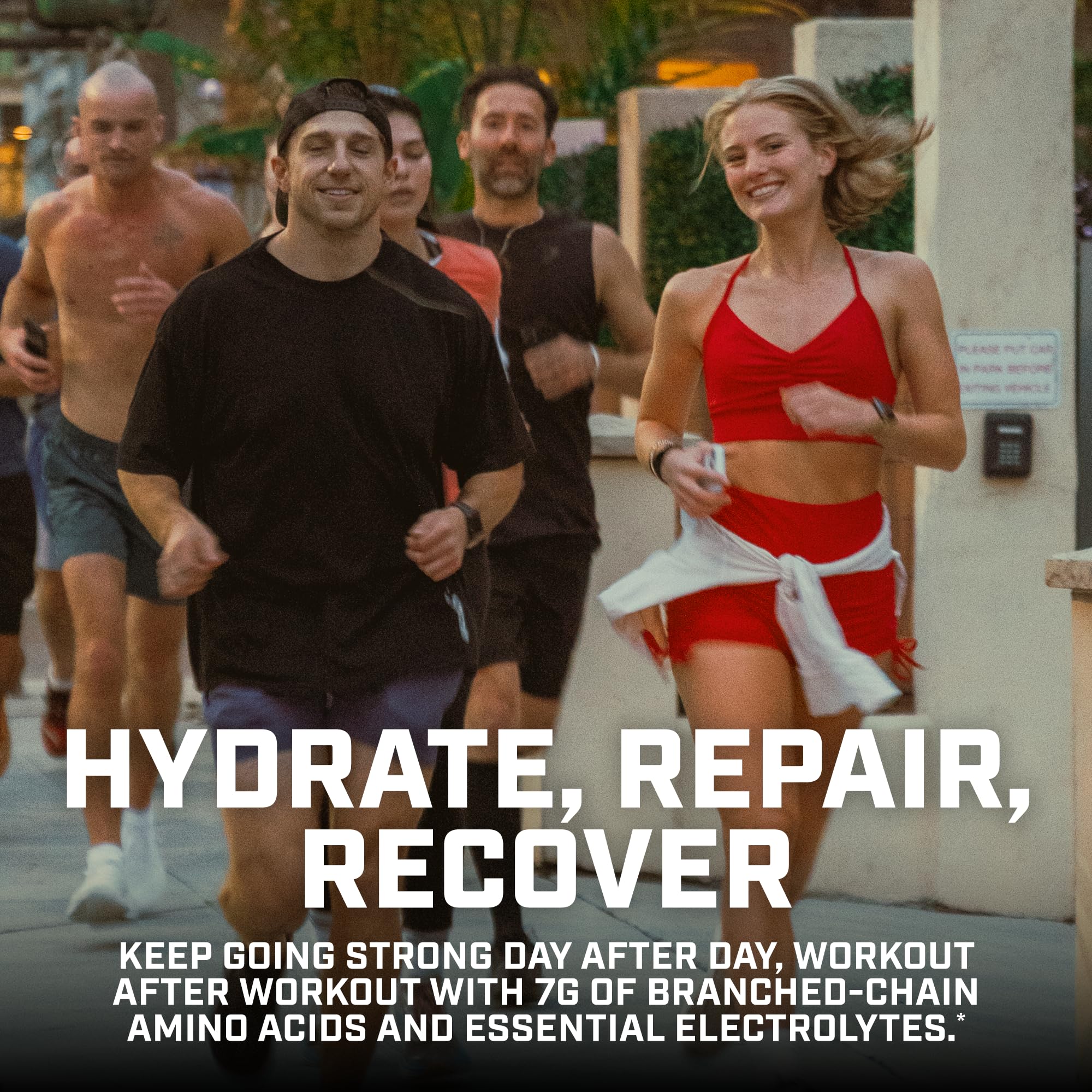 Pour of Xtend BCAA drink dispensed into a glass after exercise.