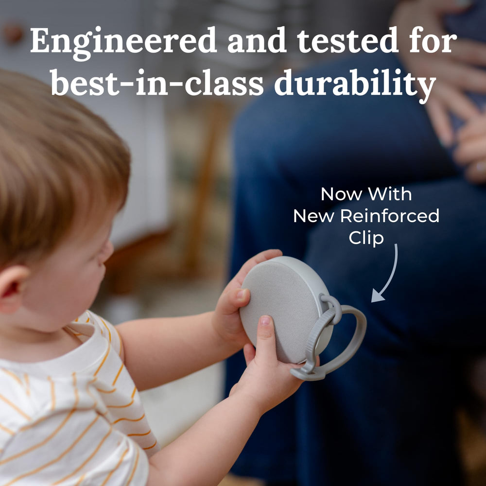 Yogasleep Duet travel-ready with clips for stroller or car seat.