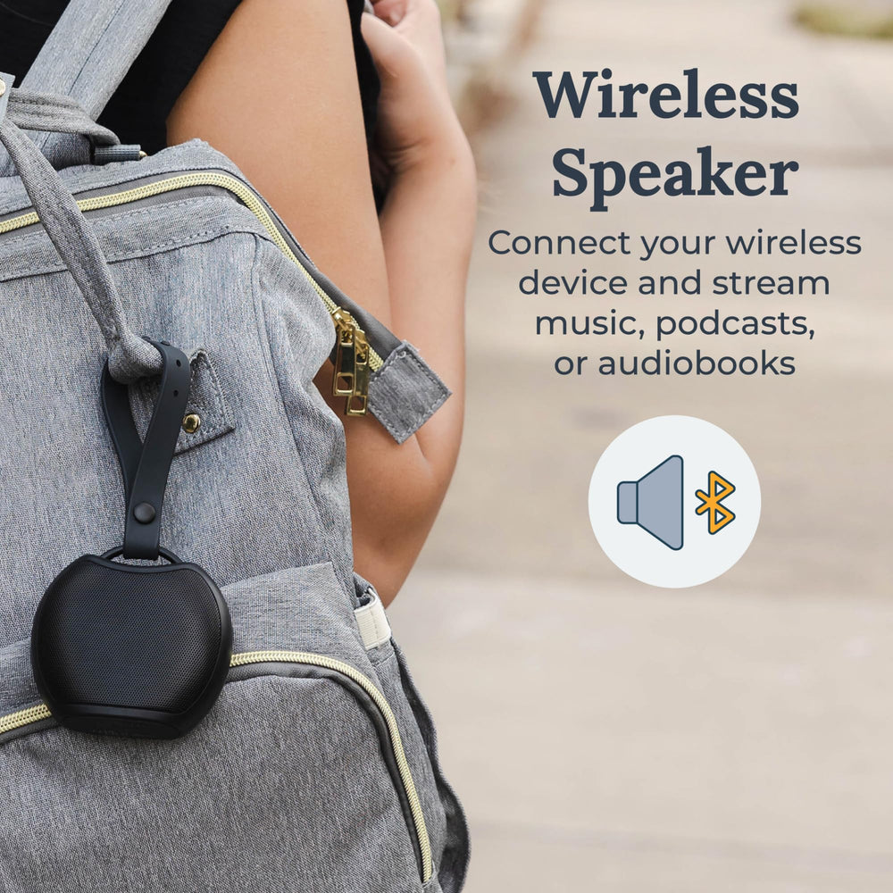 Yogasleep Rohm+ travel with silicone strap for hanging or portability.