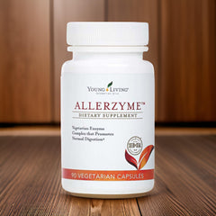 Young Living Allerzyme capsules in hand demonstrating easy daily use.