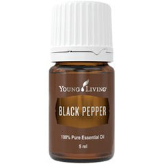 Young Living Black Pepper essential oil bottle pour evokes a spicy aroma for energy and focus.