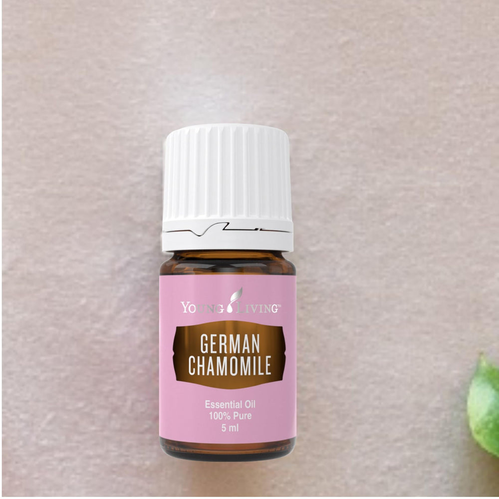 Young Living German Chamomile amber glass bottle signals premium essential oil.